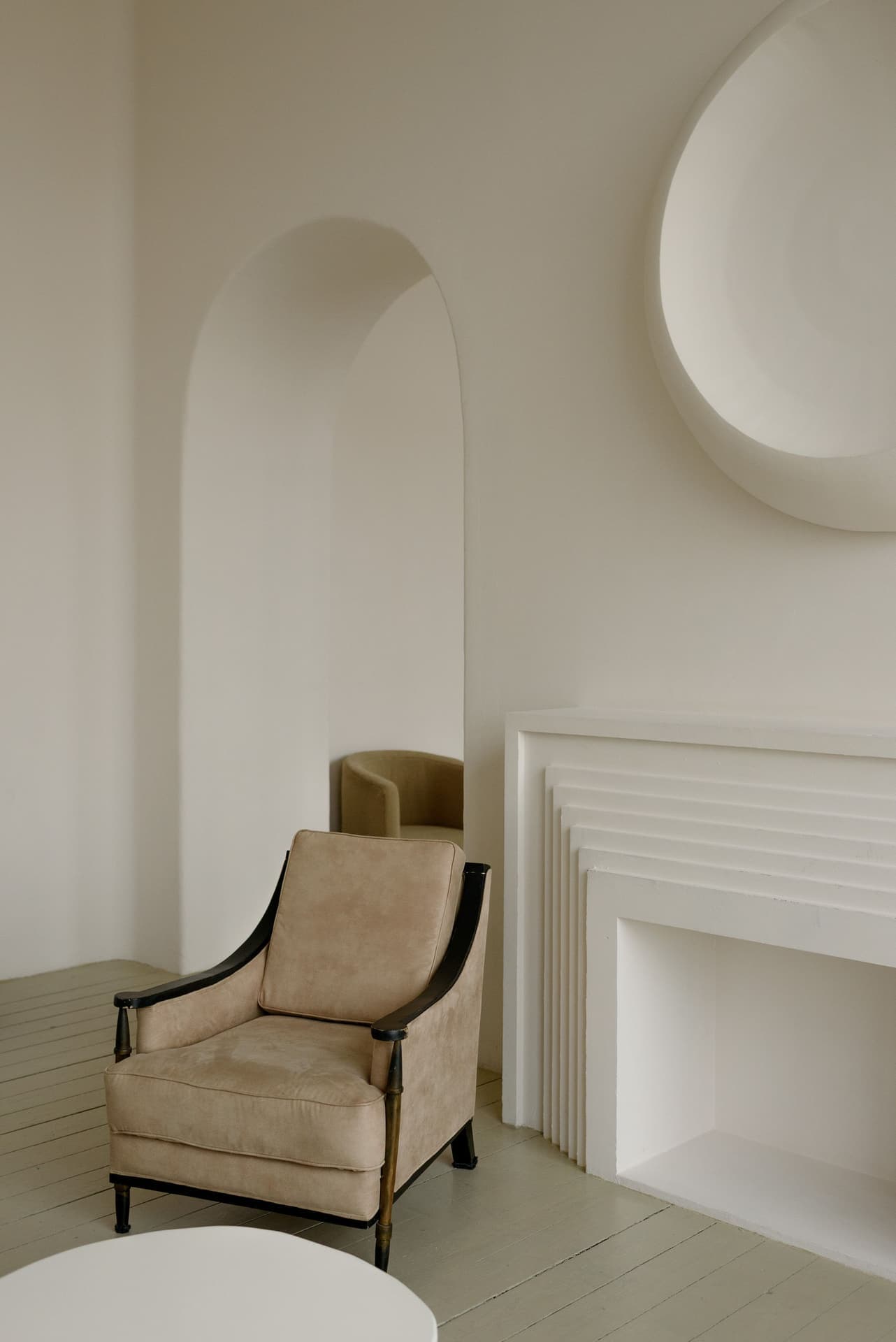 A beige armchair in the loft living room