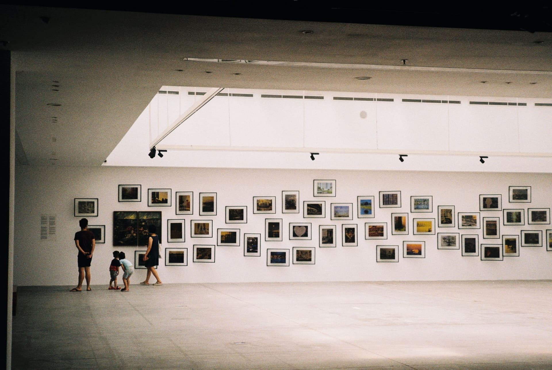 A white gallery with a single wall of work