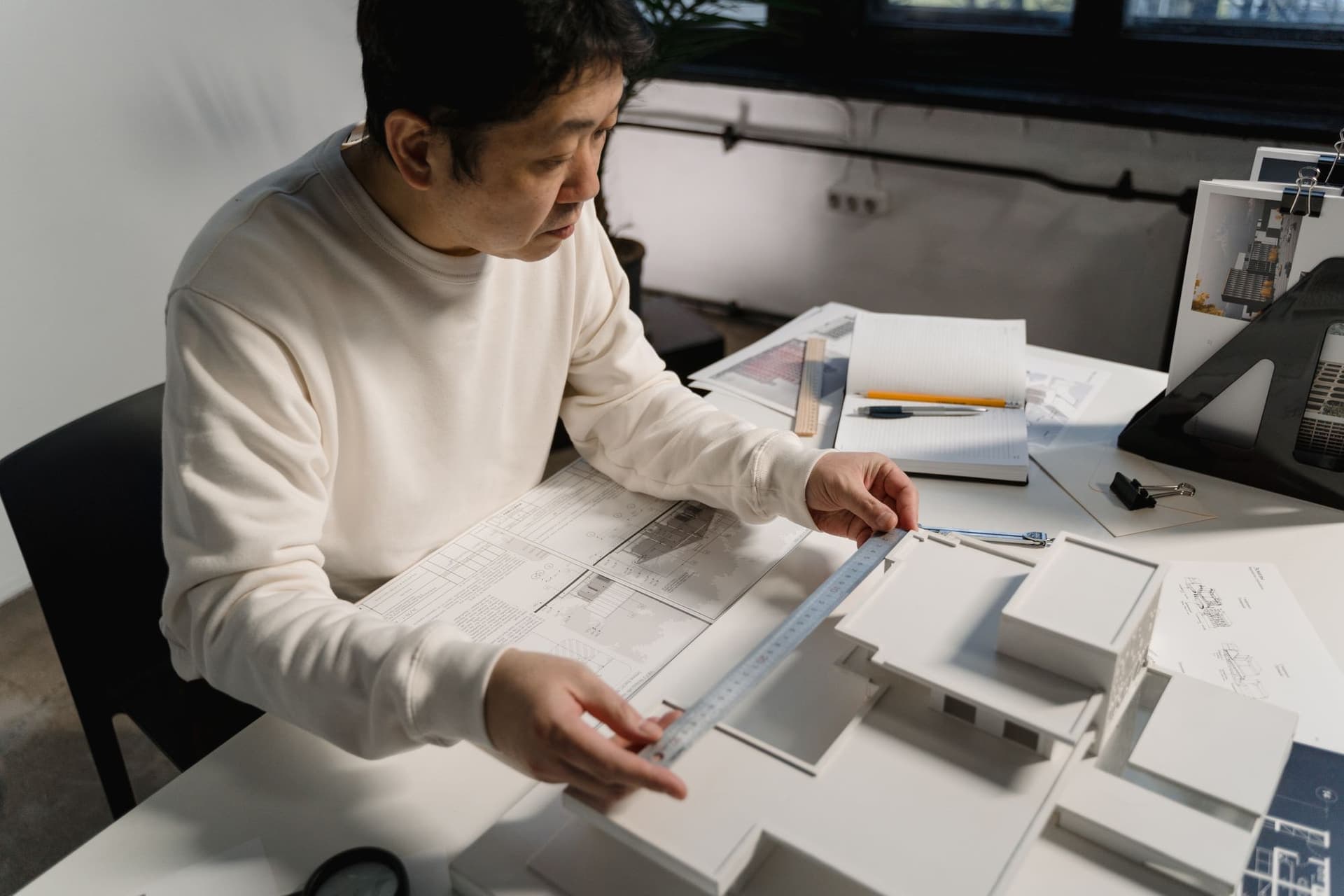 An architect at a desk in the studio
